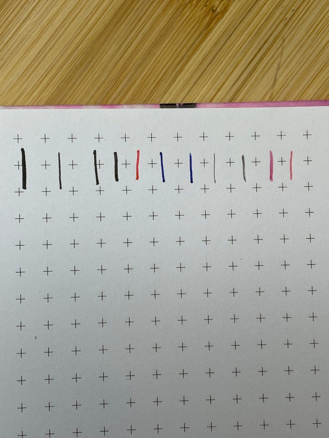 Dot-grid page inside the Venice Hardcover Notebook with colored ink pen swatches